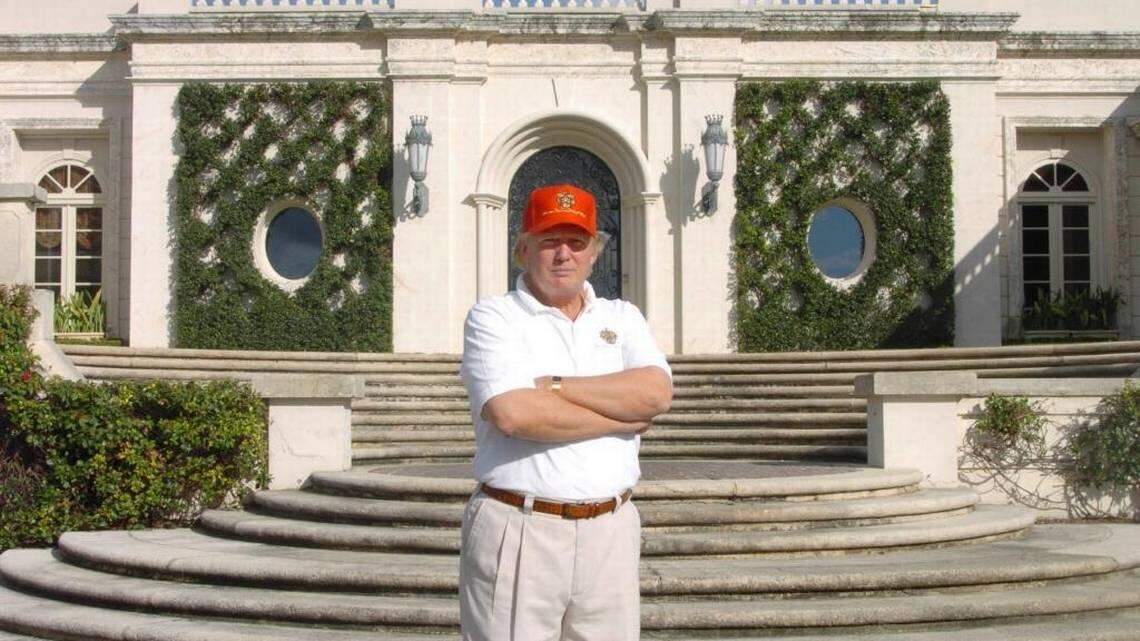 Photographed in 2005, Donald Trump stands in front of 515 N. County Rd., the estate he bought at auction for about $41 million, renovated and then sold in 2008 at a recorded $95 million.