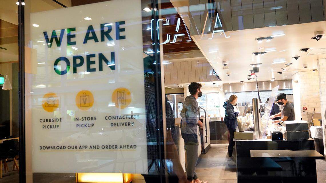 A sign advertises a restaurant opening Tuesday, March 16, 2021, in Santa Monica, Calif. Restaurants, bars and other businesses can now apply for federal COVID-19 relief to help “keep their doors open.” (AP Photo/Marcio Jose Sanchez)