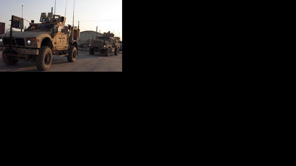 The MATV vehicle (left) will gradually take over for the MRAP vehicle (right), which has proven ill suited for the mountainous terrain of Afghanistan. (Thomas L. Day/Macon Telegraph/MCT)
