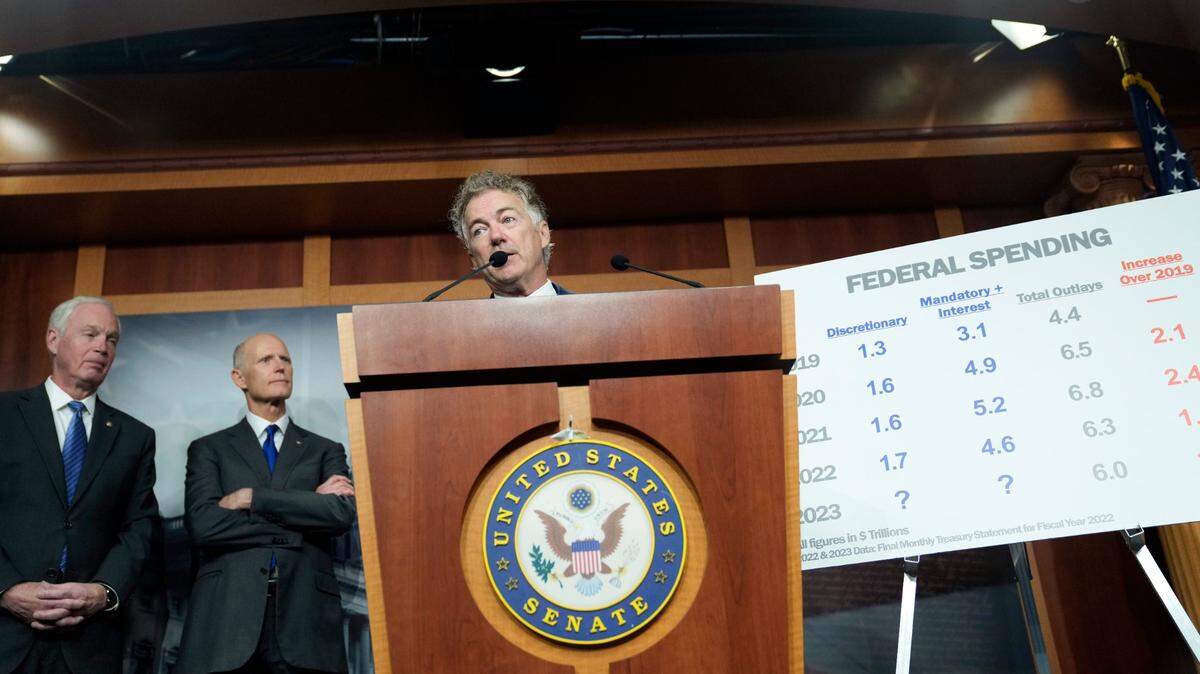 Sen. Rand Paul, R-Ky., right, Senator Rick Scott, R-Fla., center, and Sen. Ron Johnson, R-Wis., left, speak during a news conference on spending, Wednesday, Dec. 14, 2022, on Capitol Hill in Washington. (AP Photo/Mariam Zuhaib)