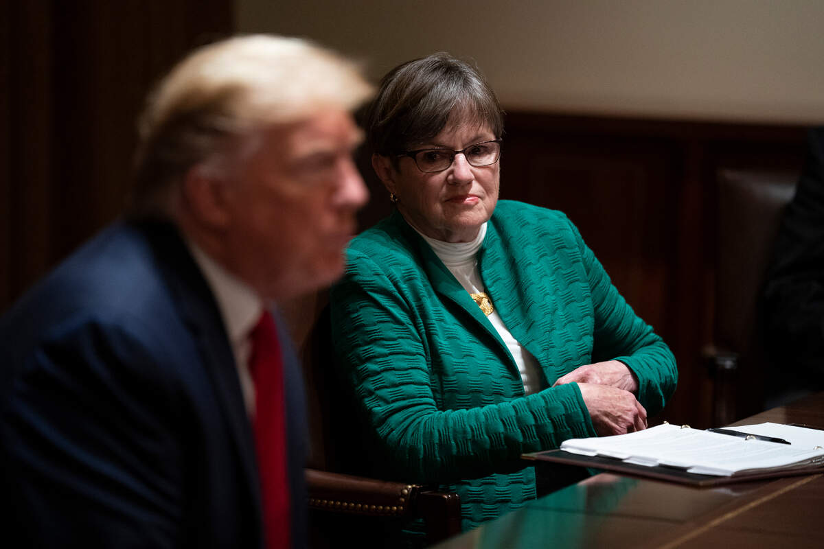 Kansas Gov. Laura Kelly listens as President Donald Trump speaks during a meeting in the Cabinet Room of the White House, Wednesday, May 20, 2020, in Washington. (AP Photo/Evan Vucci)