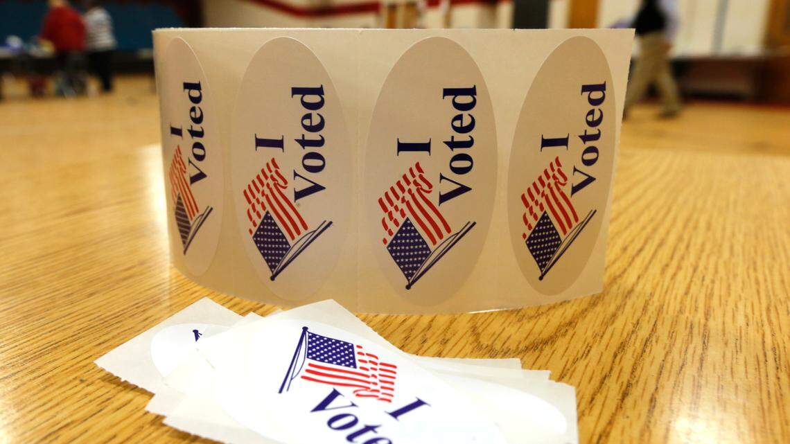 “I Voted Stickers” await voters at a polling station during the Democratic Presidential primary on Tuesday, March 3, 2020, in Richmond, Va. (AP Photo/Steve Helber)