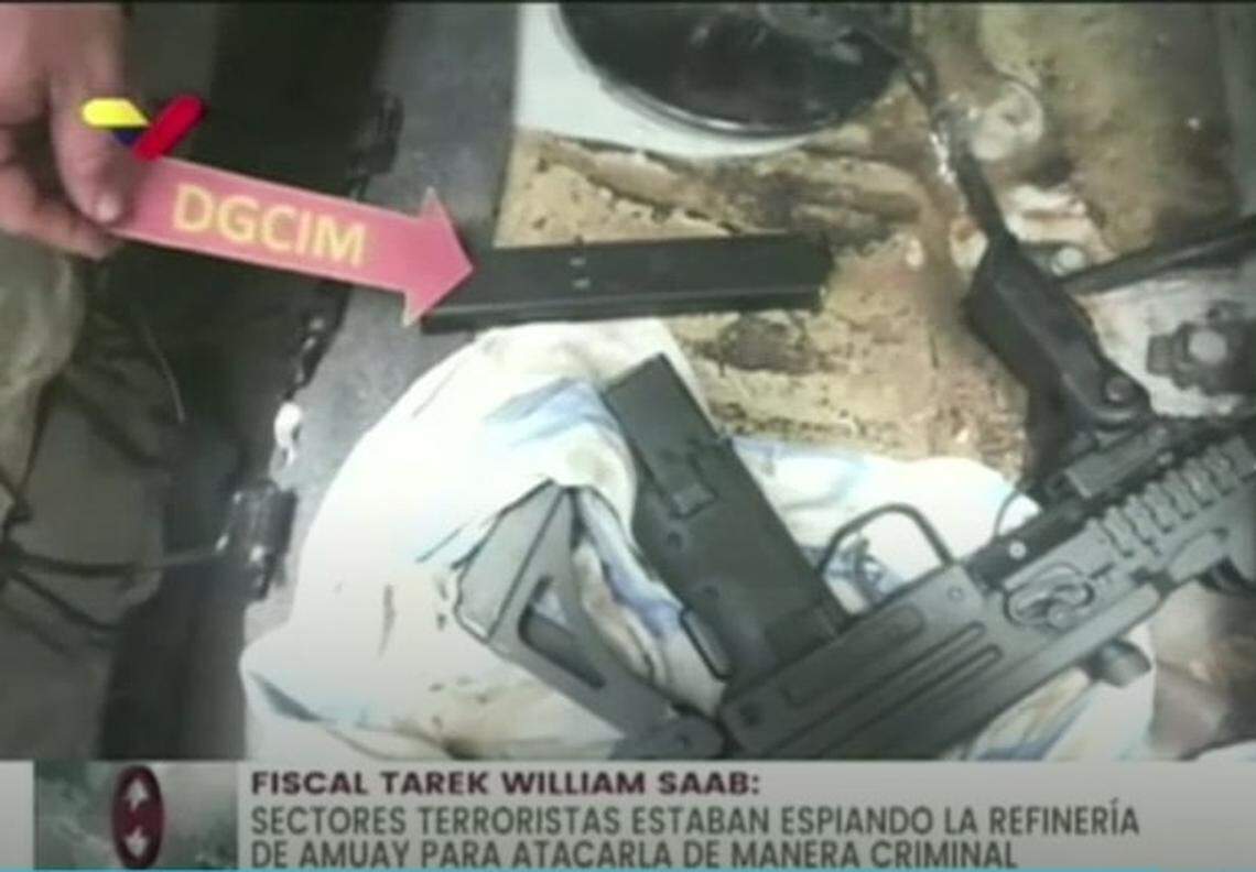 The screenshot of a Venezuelan state TV broadcast shows the purported arsenal seized when retired U.S. Marine Matthew J. Heath was arrested there in September 2020. His family in Tennessee denies the accusations that the Iraq war veteran was a spy or terrorist.