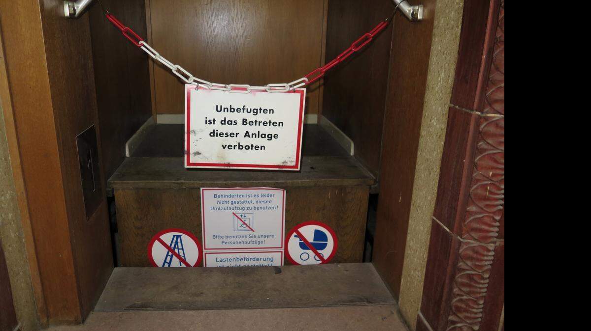 Warning signs on the Paternoster in Schoeneberg town hall in Berlin on June 12, 2015. The alternative elevators are in constant motion and require users to hop on, hop off. 
