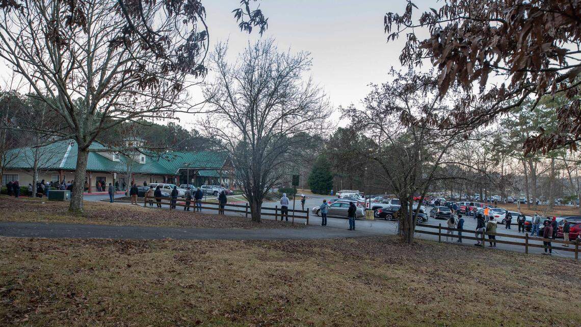 Voters wait in line to cast their ballots in Georgia’s Senate runoff elections at a senior center, Tuesday, Jan. 5, 2021, in Acworth, Ga. (AP Photo/Branden Camp)