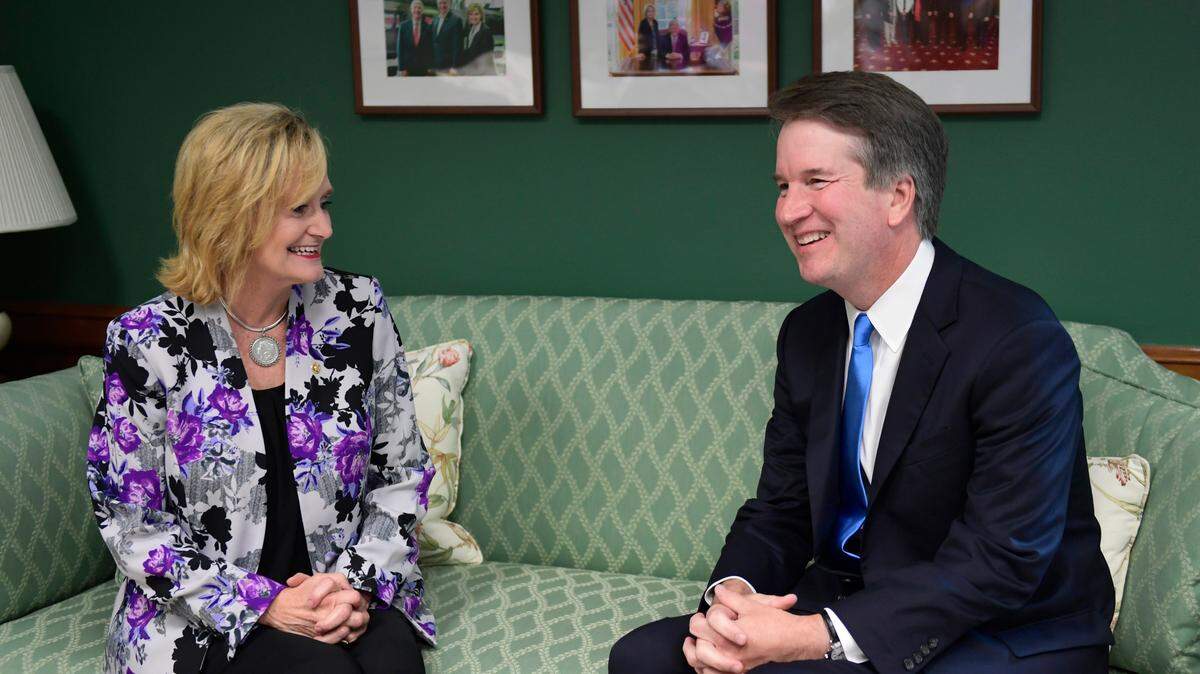 Sen. Cindy Hyde-Smith, R-Miss., left, meets with Supreme Court nominee Brett Kavanaugh, right, in her office on Capitol Hill in Washington, Wednesday, July 25, 2018. (AP Photo/Susan Walsh)