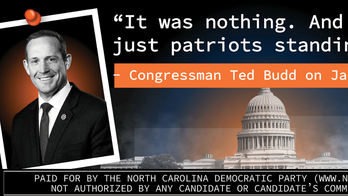 The North Carolina Democratic Party hangs a billboard outside the Wilmington airport to remind voters of Rep. Ted Budd’s comments about the Capitol insurrection ahead of a Trump rally.
