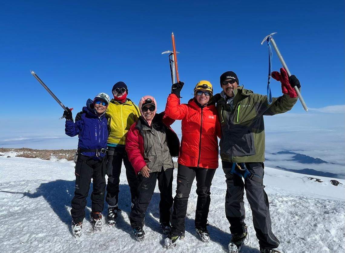 Mingrey Hildebrandt (left), Dr. Leyton Jump, Rose Vanderhoof, Aleah Haugen and Chris Haugen are shown in this photo at the summit of Mount Rainier on July 10.