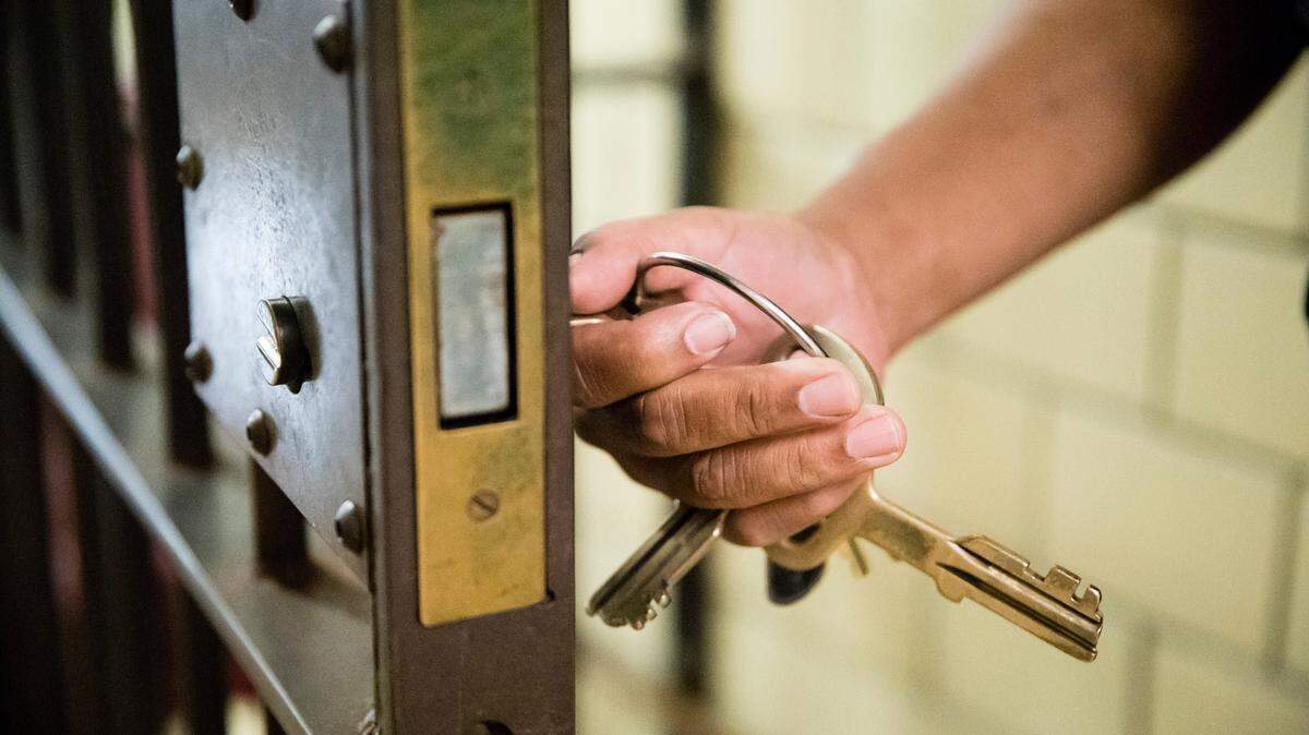 In this Tuesday, Oct. 23, 2018 photo, a guard opens a gate at the deactivated House of Correction in Philadelphia, which has used grants to reduce it’s jail population by about 36 percent.