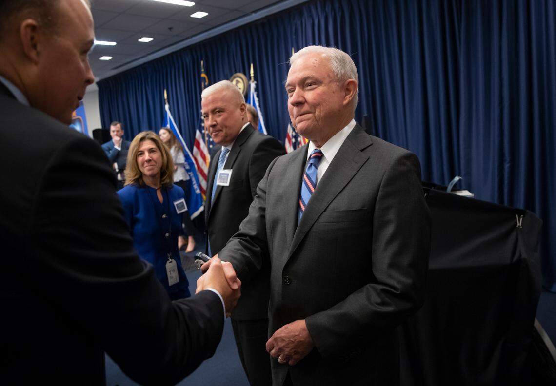 Attorney General Jeff Sessions greets new immigration judges after outlining Trump administration policies, in Falls Church, Va., Monday, Sept. 10, 2018. To Sessions’ right is former Guantánamo war court judge Vance Spath..