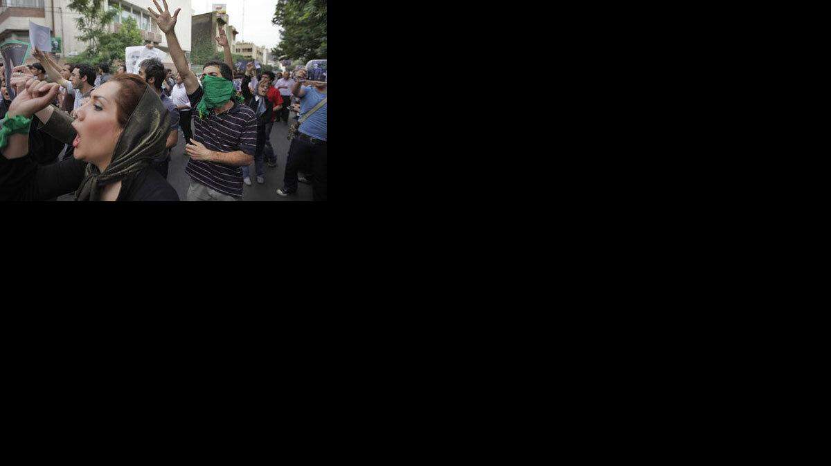 Supporters of reformist candidate Mir Hossein Mousavi, some wearing green as the color of the party, gather on the streets protesting the results of the Iranian presidential election in Tehran, Iran, Saturday, June 13, 2009. Iranian riot police have clashed with supporters of the main opposition candidate in disputed presidential elections. (AP Photo/Ben Curtis)