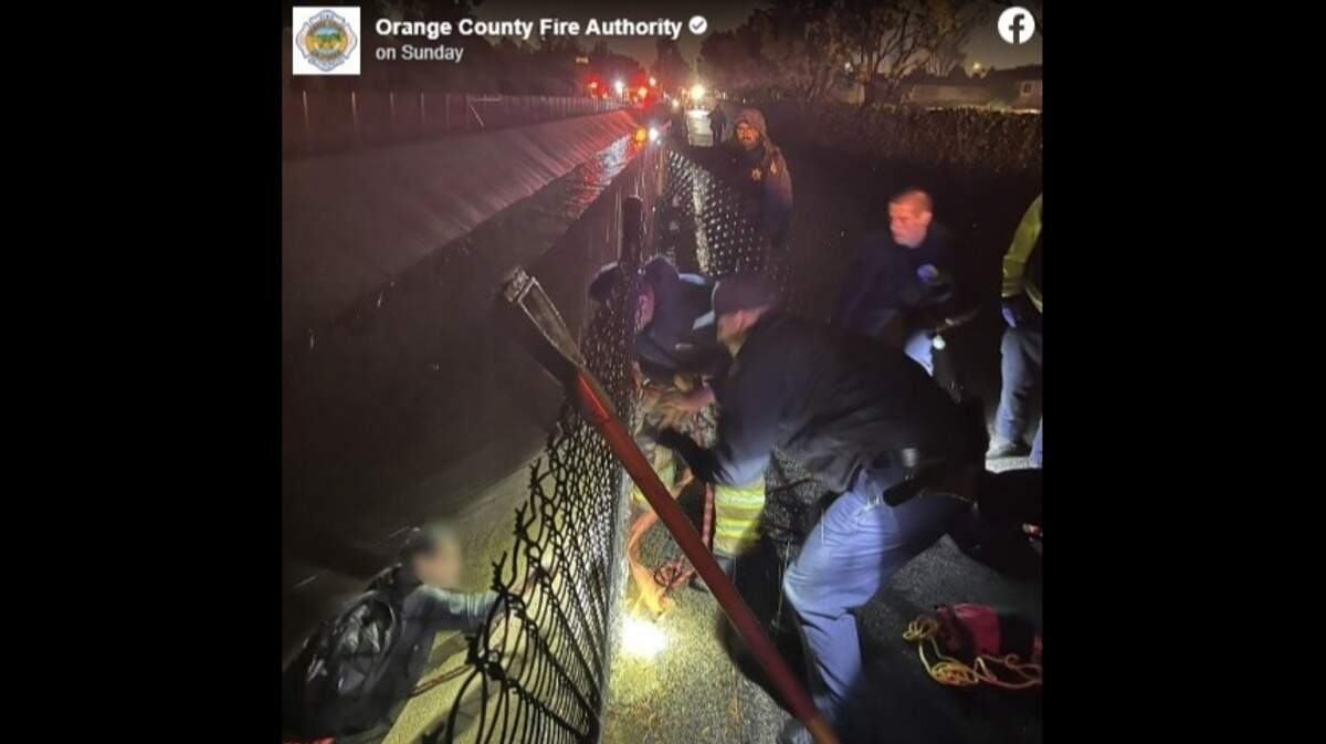 A man was rescued from a storm channel after he was found clinging on to the embankment, California officials said.