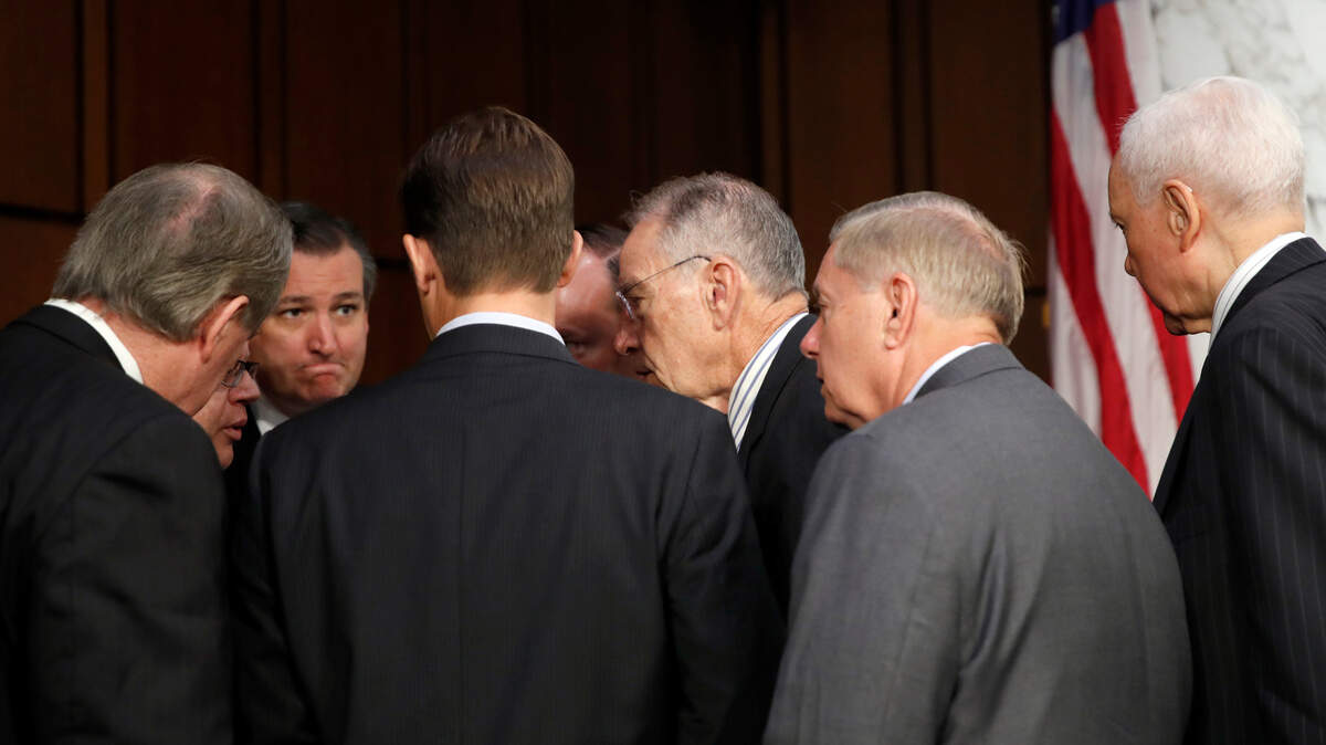 Republican members of the Senate Judiciary Committee, Sen. Mike Crapo, R-Idaho, left, Sen. Ted Cruz, R-Texas, Sen. Ben Sasse, R-Neb., Sen. Mike Lee, R-Utah, Chairman Chuck Grassley, R-Iowa, Sen. Lindsey Graham, R-S.C., and Sen. Orrin Hatch, R-Utah, talk before President Donald Trump’s Supreme Court nominee, Brett Kavanaugh testifies before the Senate Judiciary Committee on Capitol Hill in Washington, Thursday, Sept. 6, 2018, for the third day of his confirmation to replace retired Justice Anthony Kennedy.