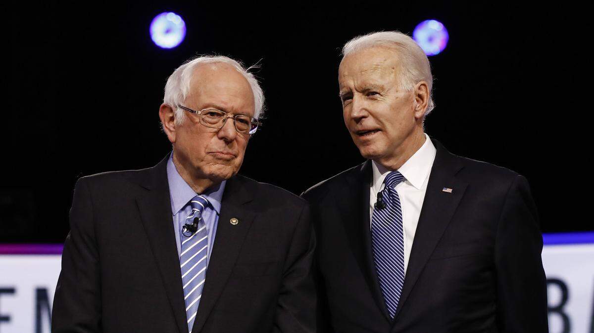 FILE - In this Tuesday, Feb. 25, 2020 file photo, Democratic presidential candidates, Sen. Bernie Sanders, I-Vt., left, and former Vice President Joe Biden, talk before a Democratic presidential primary debate in Charleston, S.C. (AP Photo/Matt Rourke)