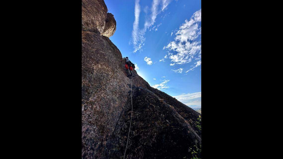 Workers climbed up cliffs to reach two California condor nests to give young birds a health exam at Pinnacles National Park, officials said.
