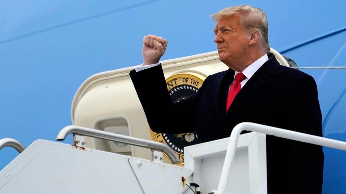 President Donald Trump gestures as he steps off Air Force One upon arrival at Valley International Airport, Tuesday, Jan. 12, 2021, in Harlingen, Texas. (AP Photo/Alex Brandon)