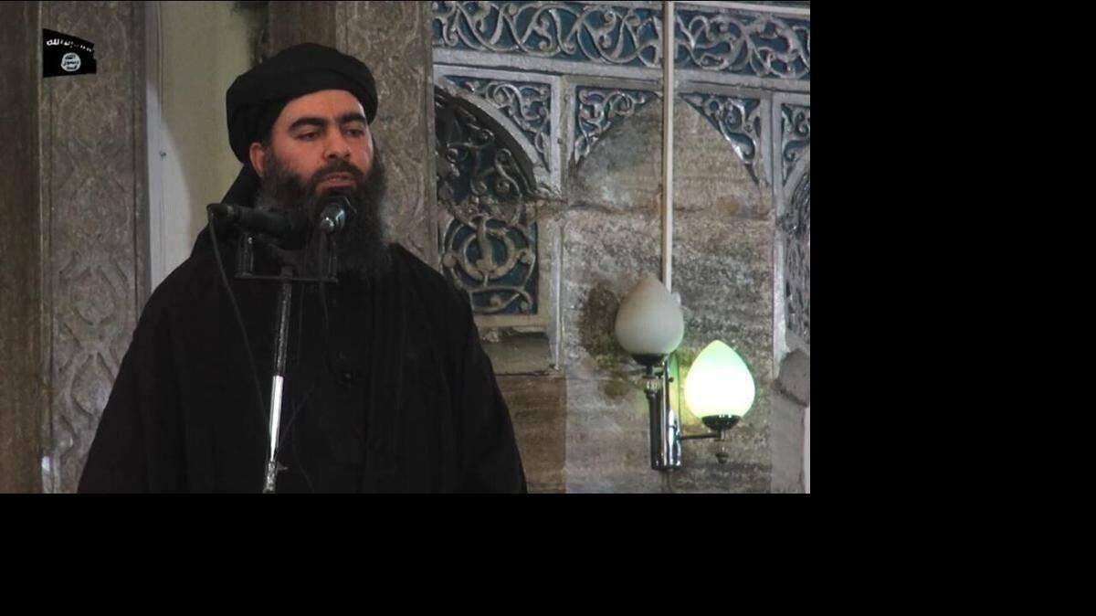 The first photo released of Caliph Abu Bakr Al Bagdadi during delivering his Friday speech in Mosul yesterday.  (Mousab Alhamadee/McClatchy)