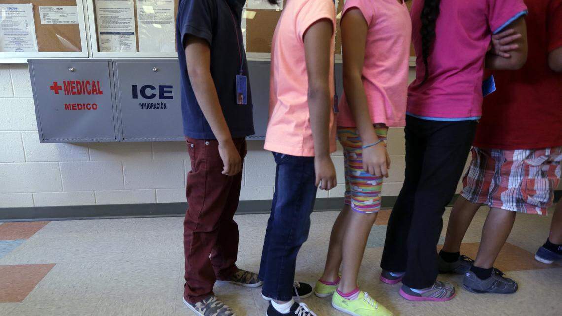 Detained immigrant children line up in the cafeteria at the  Karnes County Residential Center, a temporary home for immigrant women and children detained at the border, in Karnes City, Texas, in this Sept. 10, 2014, file photo.