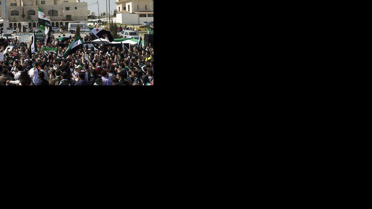 Syrians in Amman, Jordan, demonstrate outside the Syrian embassy.