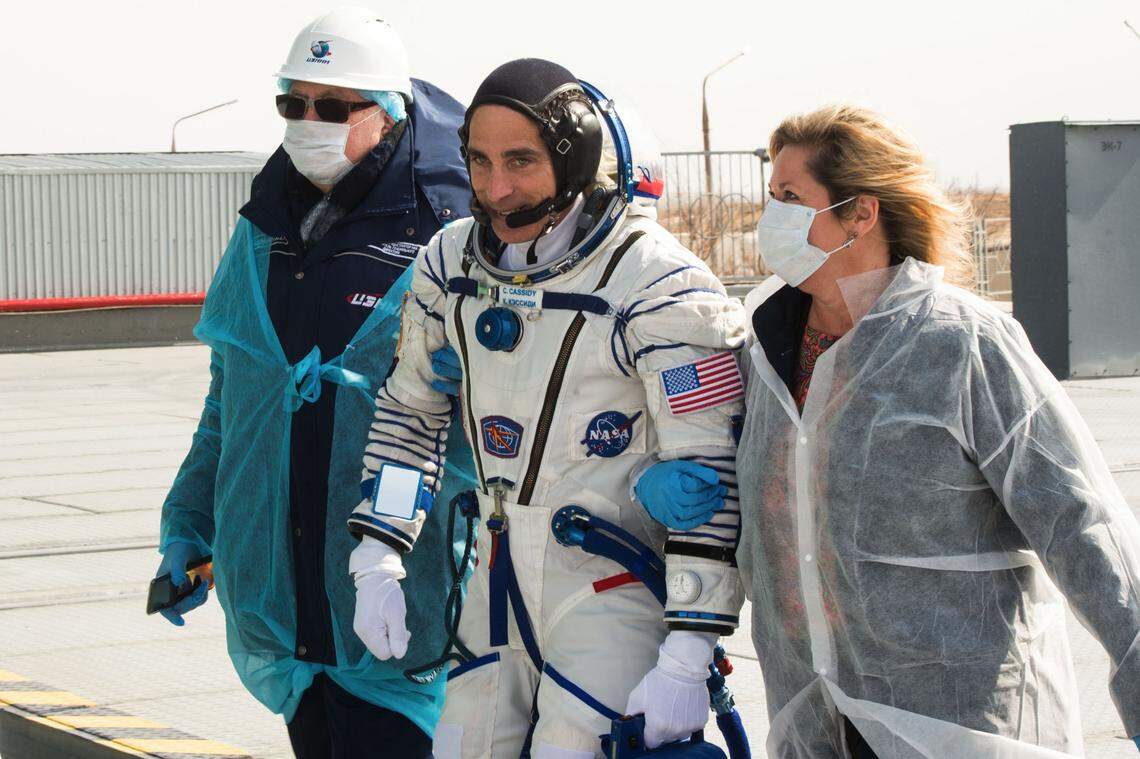Expedition 63 crew member Chris Cassidy of NASA walks to board the Soyuz rocket with NASA’s director for Human Space Flight Programs, Russia, Tricia Mack, on right, ahead of the launch in April 2020.