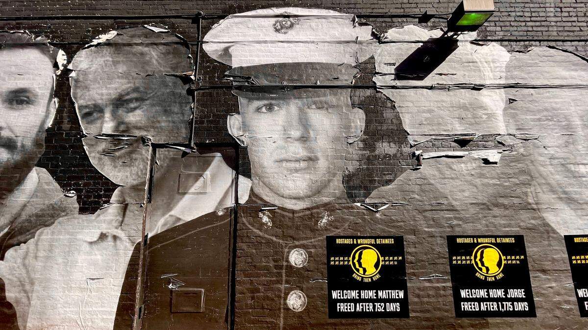 Matthew Heath is pictured in a mural of Americans wrongfully detained abroad in the Georgetown neighborhood of Washington, D.C
