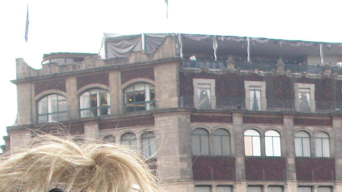 Samantha Scheller videotapes Liz Leidel for her story on citizens protesting in Mexico City's Zocalo.