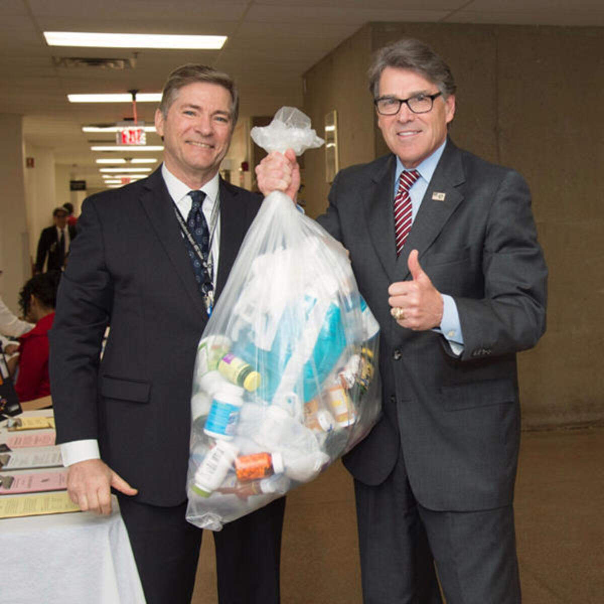 This handout photo from the Energy Department posted on April 25, 2018, on the Facebook page of Energy Secretary Rick Perry (r) shows him with Jody Hudson (l), then the top human resource official for the agency. Hudson is a witness in money laundering civil lawsuit playing out in a Virginia courtroom.