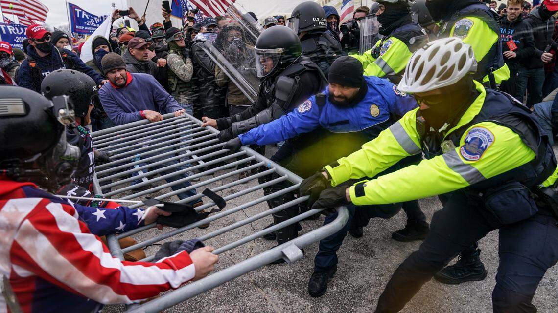 In this Jan. 6, 2021, photo, supporters of then-President Donald Trump try to break through a police barrier at the Capitol in Washington. In its annual report released Monday, the Southern Poverty Law Center said it identified 838 active hate groups operating across the U.S. in 2020. The SPLC’s report comes out nearly a month after a mostly white mob of Trump supporters and members of far-right groups violently breached the U.S. Capitol.