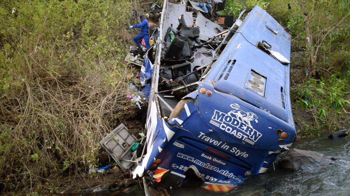 A view of the wreckage of a bus that plunged into Nithi bridge in Tharaka Nithi county Meru, Kenya, Monday, July 25, 2022. (AP Photo/Dennis Dibondo)