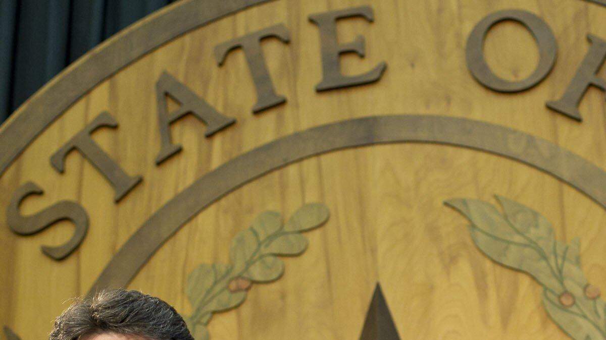 Texas Gov. Rick Perry took exception to criticism of Texas' voter ID law, asking President Obama to apologize for attorney general Eric Holder's comments.