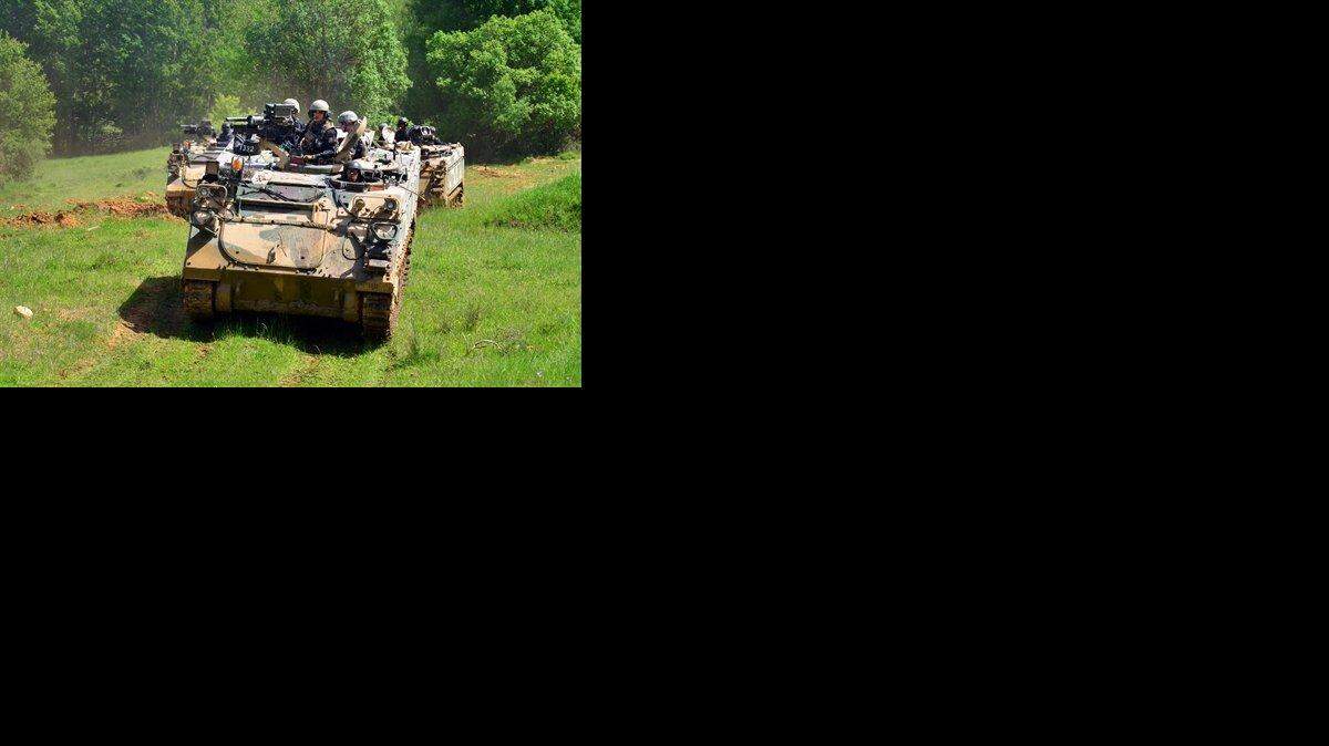 U.S. soldiers in an M113 armored personnel carrier participate in NATO exercises in Hohenfels, Germany on May 22, 2014.