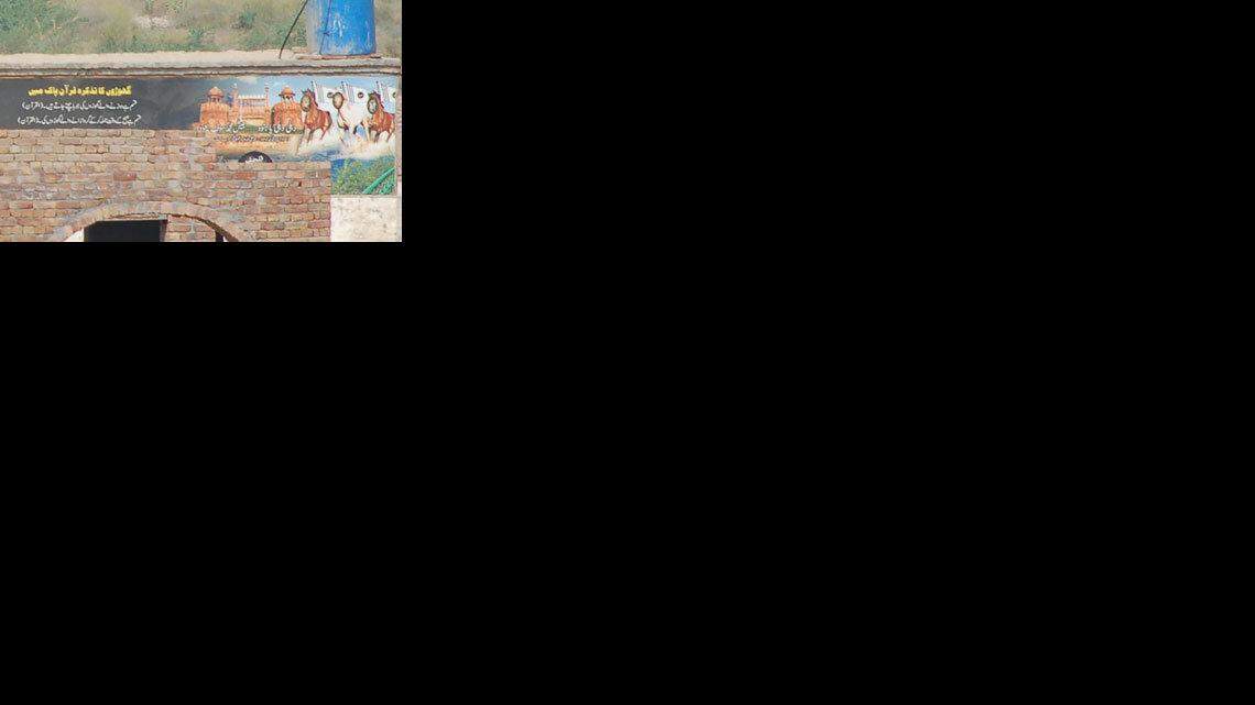 A painting on a wall inside the new compound belonging to the terrorist group Jaish-e-Mohammad, just outside Bahawalpur, Pakistan, shows jihadist inscriptions and insignia. Here on the right, the black and white flag of Jaish-e-Mohammad is visible, alongside the deeply symbolic picture of the Red Fort in Delhi, India, and charging horses. It declares that "Jaish-e-Mohammad will return", implying that group will attack India again. The extremist organization was behind the 2001 assault on the Indian parliament in Delhi. (MCT)