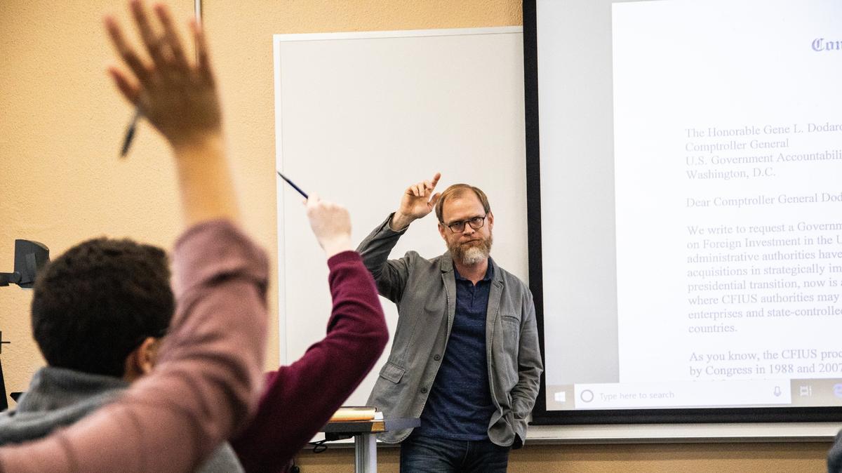 Professor Mark Nance delivers a lecture on financial governance Thursday, Nov. 15, 2018 at North Carolina State University. Some teachers are adapting to new questions and others are developing new courses in the polarized age of Trump.