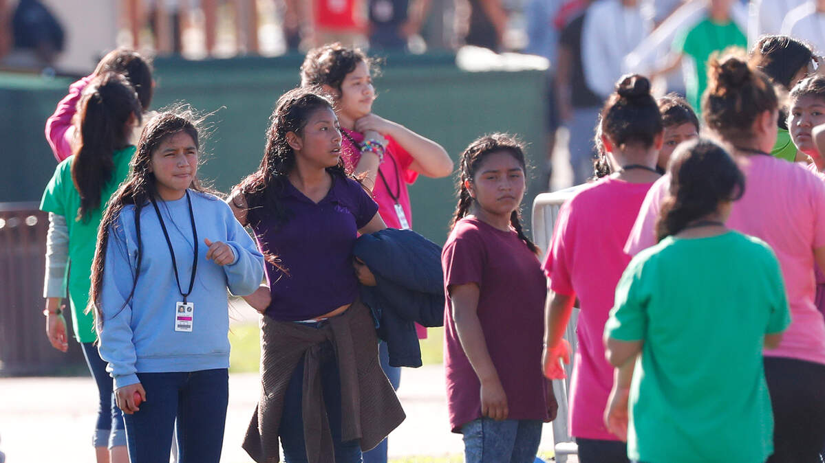 Young girls rest after playing soccer at the Homestead Temporary Shelter for Unaccompanied Children, Tuesday, Feb. 19, 2019, in Homestead, Florida.