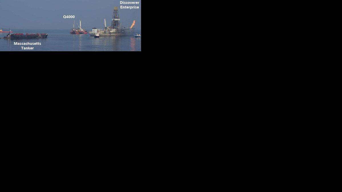 This photo, included in a BP PowerPoint presentation Friday, June 11, shows the Q4000 drilling rig that will be used to burn as much as 10,000 barrels per day of crude oil from the Deepwater Horizon well. The photo also shows the Discoverer Enterprise, the ship that is currently capturing around 15,000 barrels of oil a day.