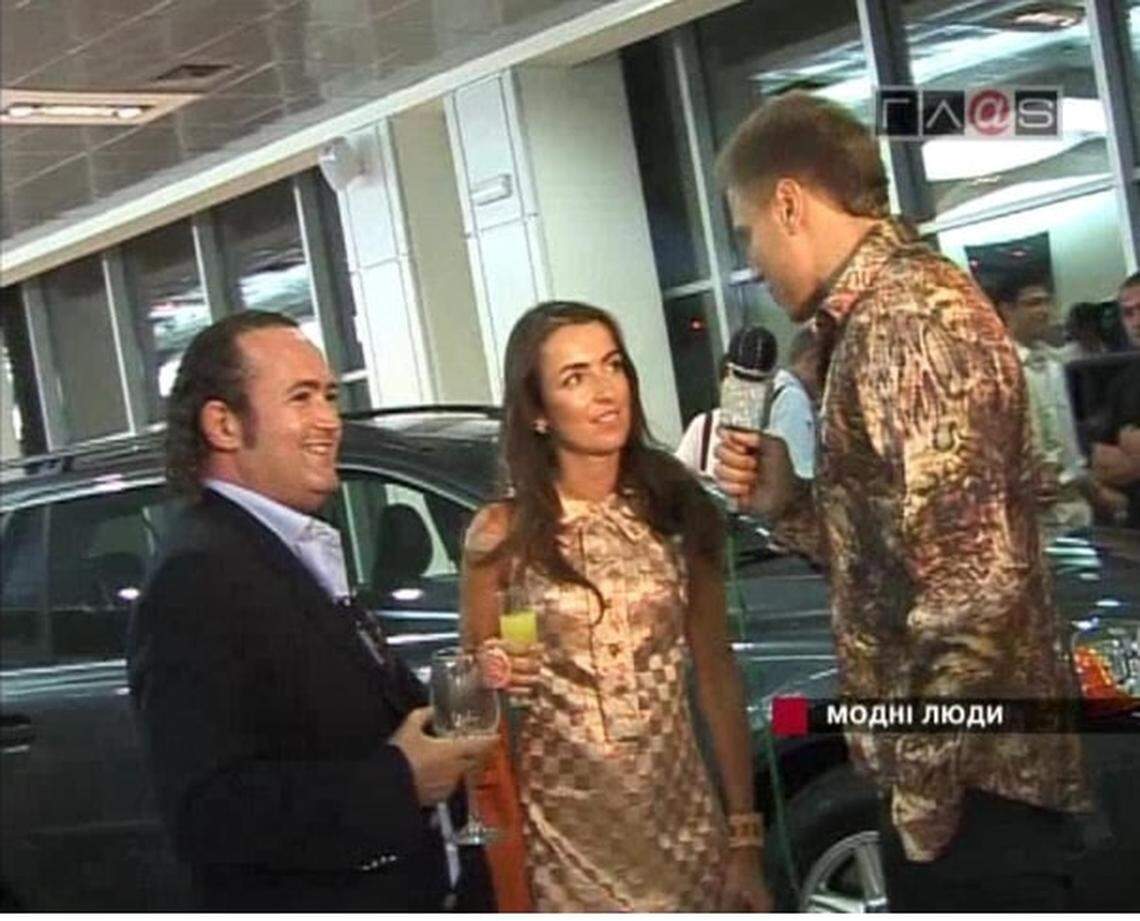 This screenshot of a 2011 Ukrainian television interview shows Igor Fruman and his wife Liza Naumova at Royal Motors, a Ukrainian luxury car dealership they owned at the time.