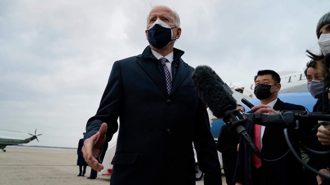President Joe Biden speaks to member of the media after exiting Air Force One, Friday, Feb. 19, 2021, in Andrews Air Force Base, Md. His administration is set to announce changes to the Paycheck Protection Program. (AP Photo/Evan Vucci)