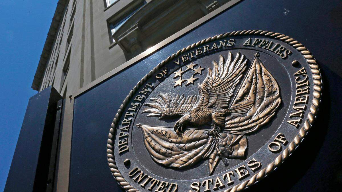 FILE - This June 21, 2013, file photo, shows the seal affixed to the front of the Department of Veterans Affairs building in Washington. (AP Photo/Charles Dharapak, File)
