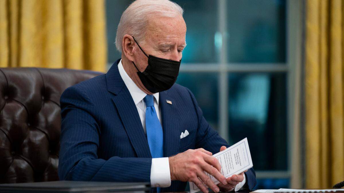 FILE - In this Feb. 2, 2021, file photo President Joe Biden delivers remarks on immigration, in the Oval Office of the White House in Washington. His plans to reduce greenhouse gas emissions do not include requiring Americans to cut back on meat consumption despite false claims from some. (AP Photo/Evan Vucci, File)