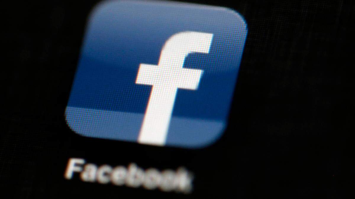 In this May 16, 2012, file photo, the Facebook logo is displayed on an iPad in Philadelphia. Facebook’s VP of Global Affairs said Sunday that the company’s decision to suspend Trump for two years is justified. (AP Photo/Matt Rourke, File)