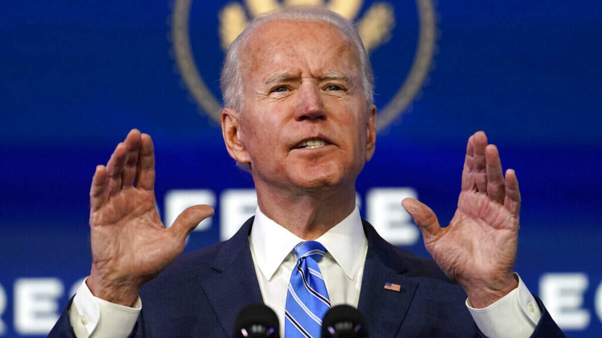 In this Jan. 14, 2021 photo, President-elect Joe Biden speaks during an event at The Queen theater, in Wilmington, Del. (AP Photo/Matt Slocum)