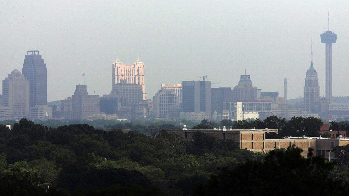 The skyline of San Antonio's downtown business district is shown.