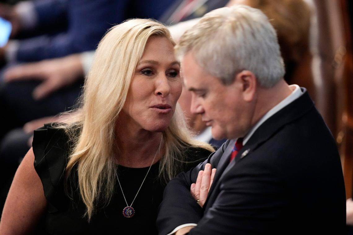 Rep. Marjorie Taylor Greene, R-Ga., talks with Rep. James Comer, R-Ky., during opening day of the 118th Congress at the U.S. Capitol, Tuesday, Jan 3, 2023, in Washington. (AP Photo/Andrew Harnik)