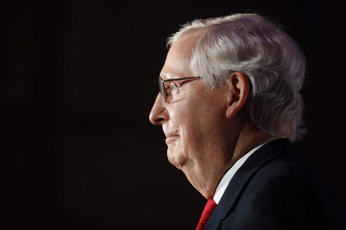 Republican Senate Majority Leader Mitch McConnell, standing with his wife Elaine Chao, gives remarks after winning reelection over Democratic challenger Amy McGrath at the Omni Hotel in Louisville, Ky., Tuesday, Nov. 3, 2020.