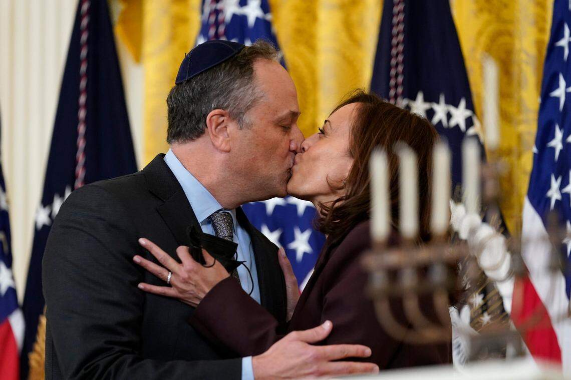 Vice President Kamala Harris and second gentleman Doug Emhoff kiss during an event in the East Room of the White House in Washington, to light the menorah to celebrate Hanukkah, on Dec. 1, 2021.