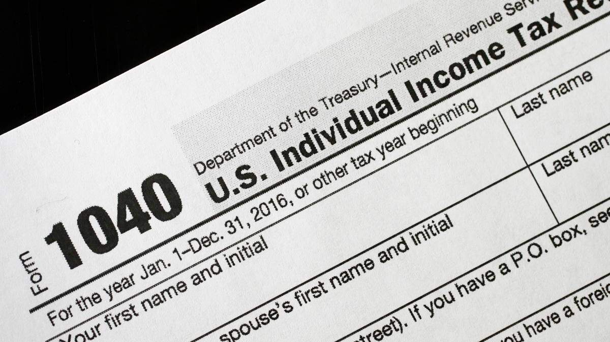 People who received some payments from their states should delay filing their taxes, officials said.