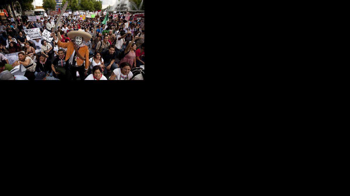 Demonstrators in Mexico City protest against a possible return of the old ruling Institutional Revolutionary Party (PRI), as well as perceived biased coverage by major Mexican TV networks.