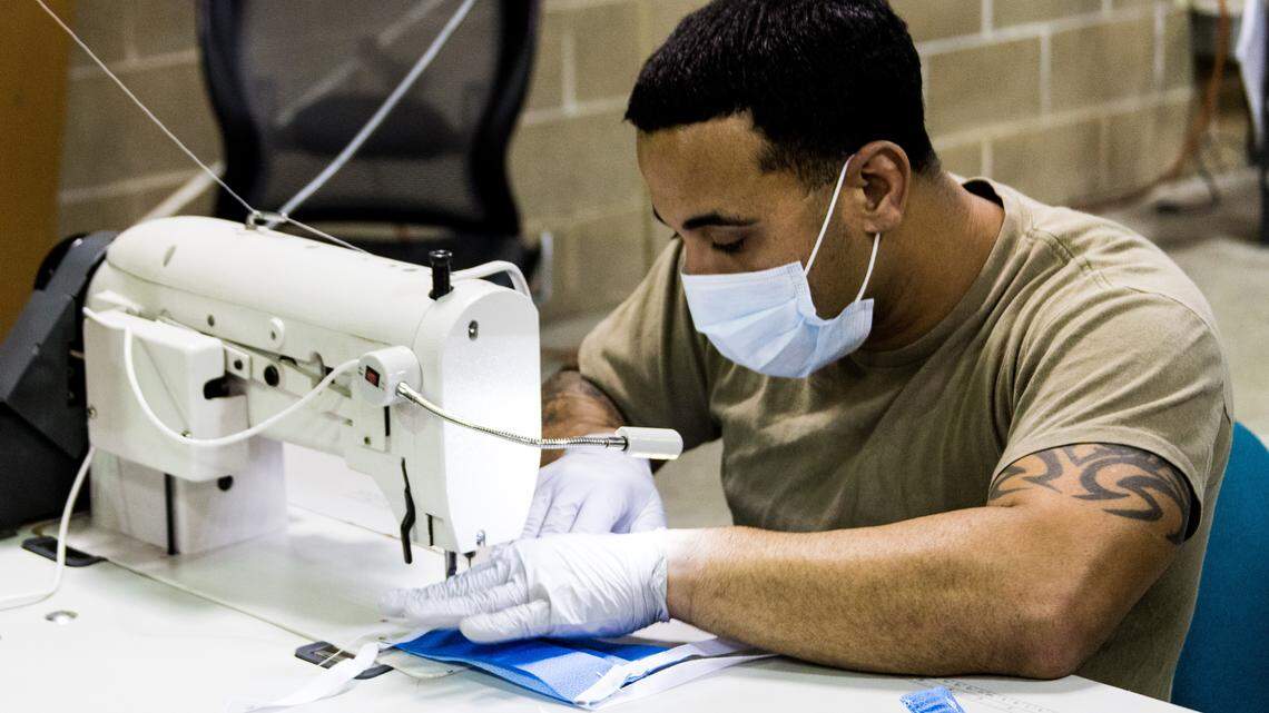 Soldiers use parachute mending skills to sew coronavirus surgical masks