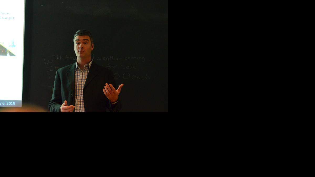 Gareth Lawson, a biologist for the Woods Hole Oceanographic Institution, discusses how changing acidity of the oceans could affect tiny marine snails known as "sea butterflies." He was speaking to a group in Cambridge, Mass., on Jan. 6, 2015.
