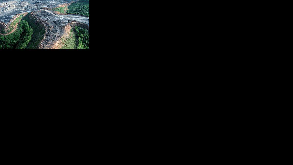 In this May 2003 file photograph, a coal mining operation in West Virginia where operators have blasted off a mountaintop to uncover valuable, low-sulphur coal seams can be seen. After the coal is removed, leftover rock and dirt is dumped into nearby valleys and streams.